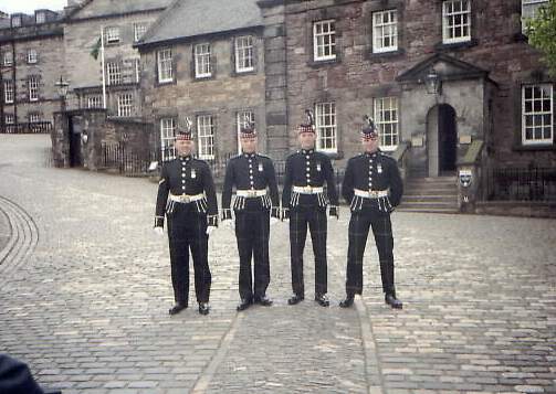 Some guards at the castle stop to pose